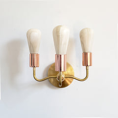 Copper and Brass Curved arm wall sconce with modern Victorian vibes
