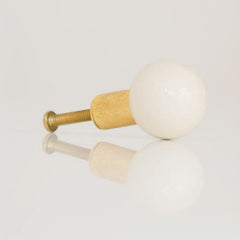 Cream and Brass drawer or cabinet pull in a globe shape by sazerac stitches