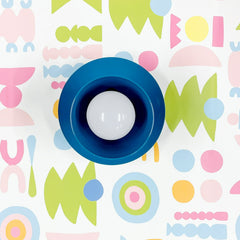 Grey blue flushmount ceiling light or wall sconce on colorful shapes wallpaper