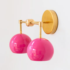 Bright Pink and brass two light mid century modern wall sconce  - far side view