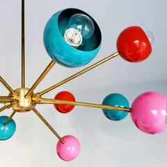 multicolored mid century modern sputnik style chandelier with pink orange and teal