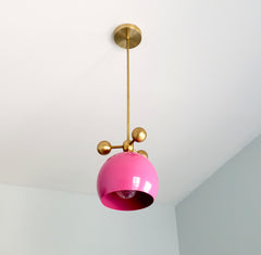 barbie doll pink and brass modern globe pendant chandelier with brass orb ball details midcentury inspired