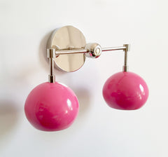 Chrome and pink bathroom sconce
