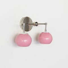 pastel pink and chrome two light vanity wall sconces with white daisy flower details