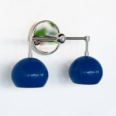 Chrome and blue mid century modern inspired bathroom wall sconce with two sockets