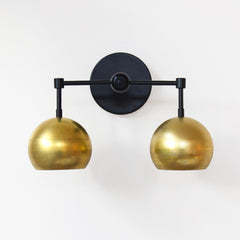 Black and brass mid century modern wall sconce
