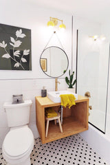 Yellow, black, and white modern bathroom with mid century modern accents