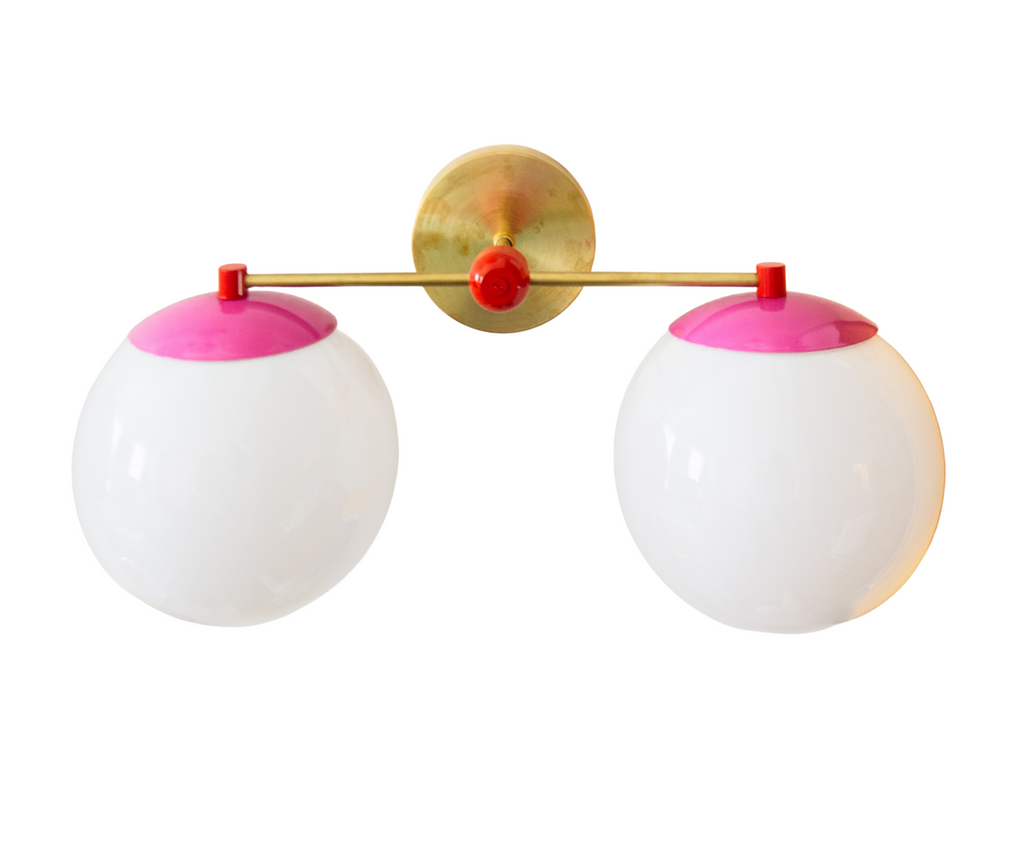 Pink, red, and brass color blocked bathroom vanity light