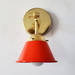 bright orange and brass adjustable cone sconce