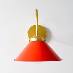 Poppy red or flame orange wall sconce with brass hardware.  This colorful mid century modern style wall sconce is great for kitchens, bathrooms, bedrooms, etc.  Also fun for kids rooms.