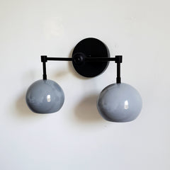 black and grey mid century modern two light bathroom wall sconce