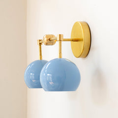 Pastel blue and brass mid century modern two light bathroom sconce