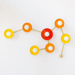 Colorful orange, yellow, and poppy red Sconce shaped like a Leo constellation