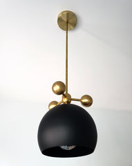 matte black and brass modern globe pendant with brass orb ball details midcentury inspired