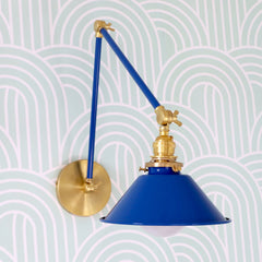 Bright blue and brass adjustable wall sconce for kitchens, bedrooms, and more