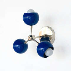 Mediterranean blue and chrome mid century modern wall sconce or flushmount ceiling light. This colorful light fixtures adds a pop of color to a small space like a kids playroom or baby boy nursery.  Adds color to eclectic decor style.