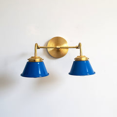 Mediterranean Blue and Brass Double Kelly Sconce features colorful shades and a raw brass finish modern bathroom lighting