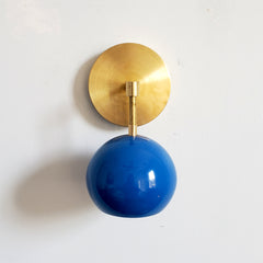 Brass and Blue modern eyeball wall sconce that is midcentury inspired