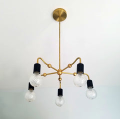 art deco brass and black curvy chandelier