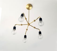 brass with black art deco inspired chandelier lighting modern home renovation design