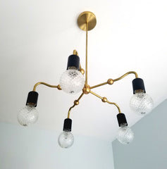 modern art decor inspired chandelier curved arms gold brass black