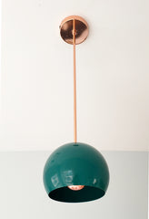 emerald green and polished copper pendant light inspired by midcentury modern design