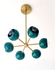 Bright green and brass orbit sputnik style pendant light chandelier with midcentury modern style and customizable colors