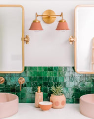 Peach and Brass Double Kelly Sconce features colorful shades and a raw brass finish modern bathroom lighting