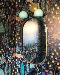 Mint and brass double loa in a jungle themed bathroom