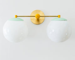 mint and mustard two light wall sconce for mid century modern bathroom renovations