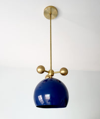 navy and brass modern globe pendant with brass orb ball details midcentury inspired