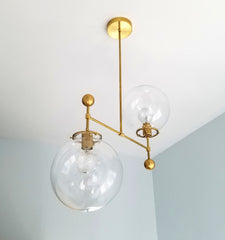 large glass globe and brass ball chandelier ceiling fixture raw brass mid century dining room light fixture