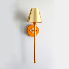 orange and brass accent light all sconce with a gold shade