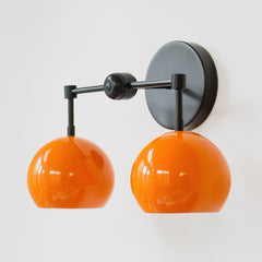 mid century modern black and orange two light wall sconce