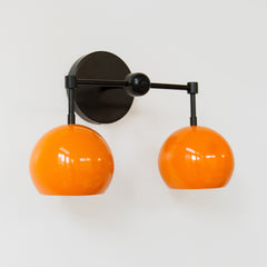 mid century modern black and orange two light wall sconce
