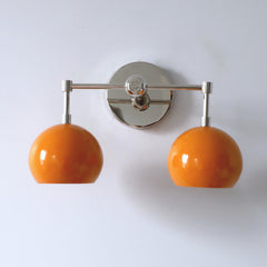 orange and chrome two light mid century modern wall sconce