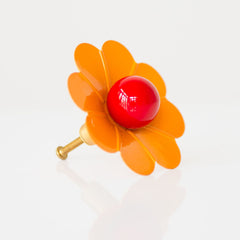orange and flame daisy drawer pull with brass accents