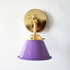 bright purple and brass modern wall sconce with a cone shade