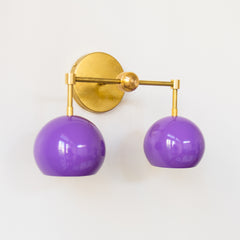brass and pastel purple two light mid century modern wall sconce