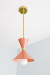 Peach and brass mid century modern inspired pendant light fixture for kitchen island design