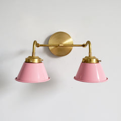 pink and Brass Double Kelly Sconce features colorful shades and a raw brass finish modern bathroom lighting