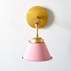 pink and brass adjustable wall sconce
