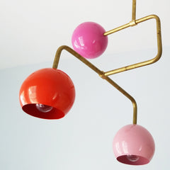 multicolored pink and gold mid century modern chandelier with colorful pink and orange globes