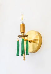 brass and green modern wall sconce with tassels