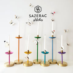 Rainbow candle collection with white butterflies