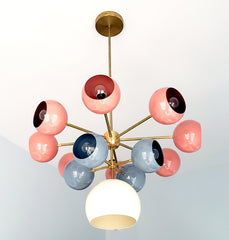 Solaris chandelier with coral grey and cream light shades mid century modern inspired southwestern colors