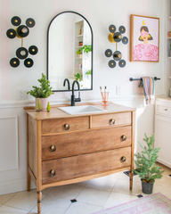 Black and brass eclectic wall sconces for a bathroom renovation