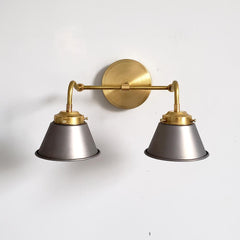 steel and brass industrial style two light wall sconce for bathroom renovations