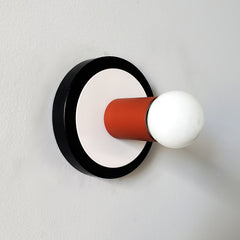 terra cotta black and white colorful wall sconce.  midcentury modern sconce