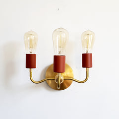 Terra Cotta and Brass Curved arm wall sconce with modern Victorian vibes